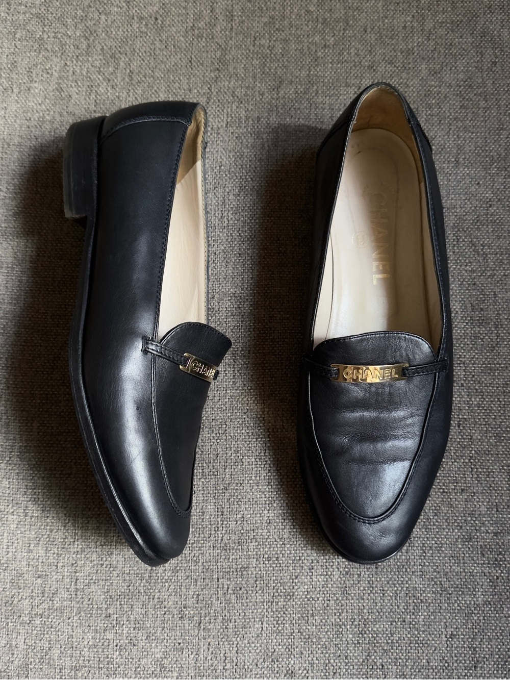 Vintage Chanel black loafers with gold hardware